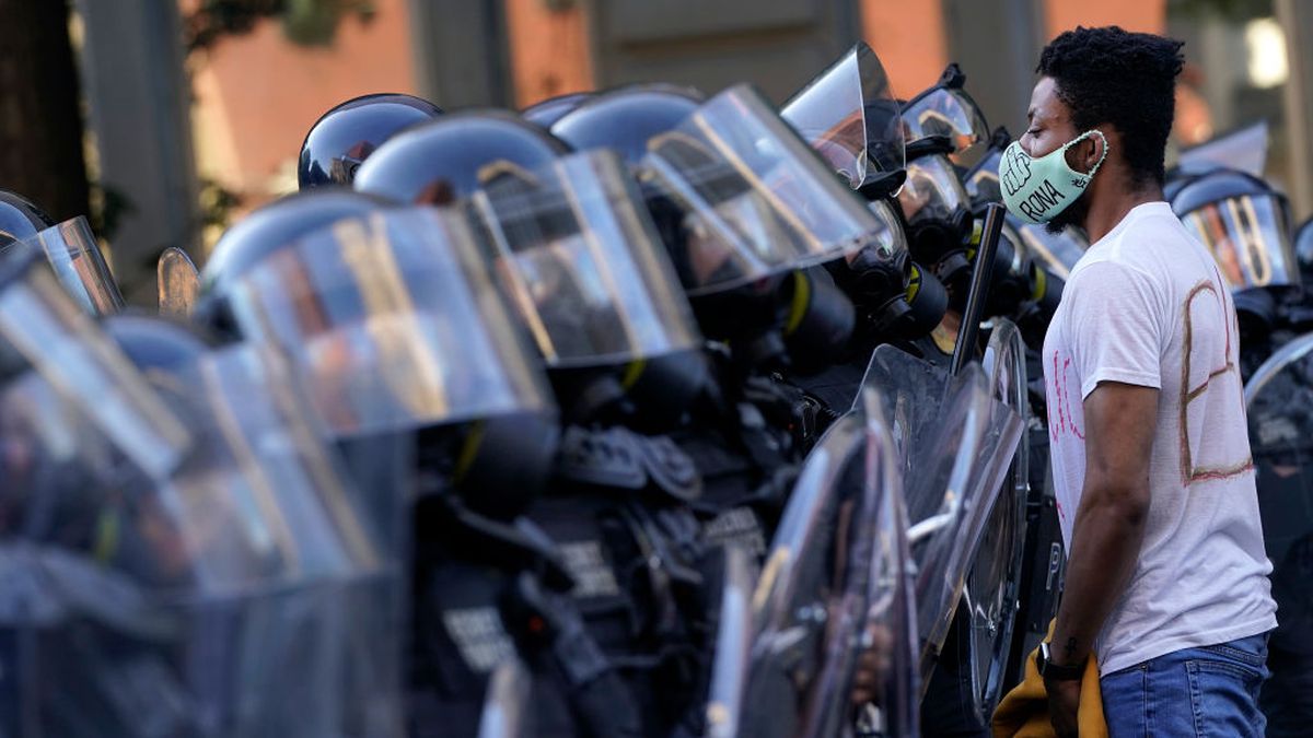 WASHINGTON, DC - JUNE 01: Demonstrators confront law enforcement during a protest on June 1, 2020 in downtown Washington, DC. Protests and riots continue in cities across America following the death of George Floyd, who died after being restrained by Minneapolis police officer Derek Chauvin. Chauvin, 44, was charged last Friday with third-degree murder and second-degree manslaughter. (Photo by Drew Angerer/Getty Images /Getty Images)