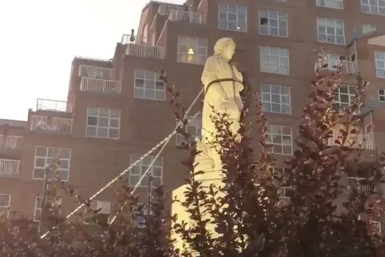 Protesters pull down the statue of Christopher Columbus