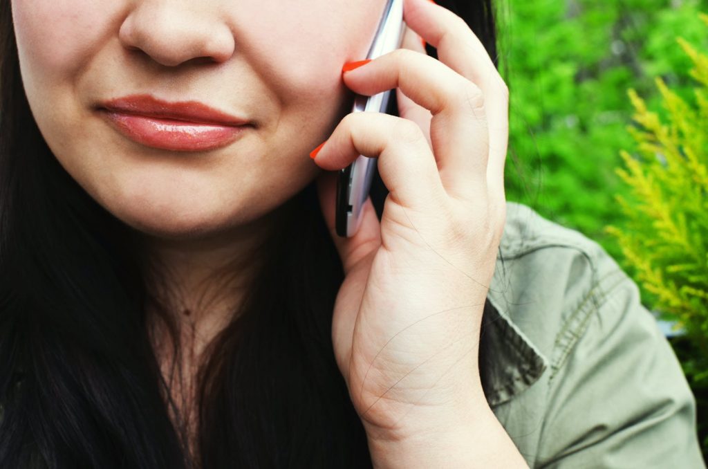 Talking on the phone while in line